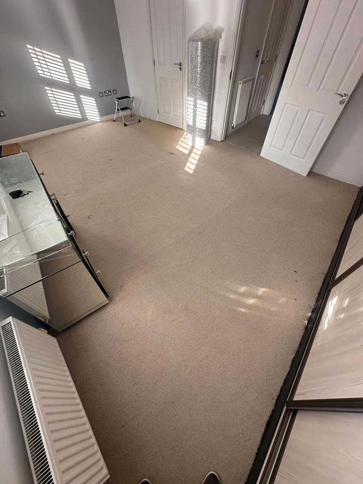 New Captivation by Abingdon carpet roll staged ready for fitting in bedroom — Bromley BR1