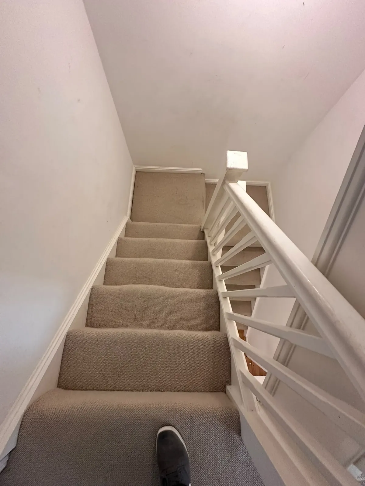 Another staircase flight with worn carpet before uplift — Bromley BR1