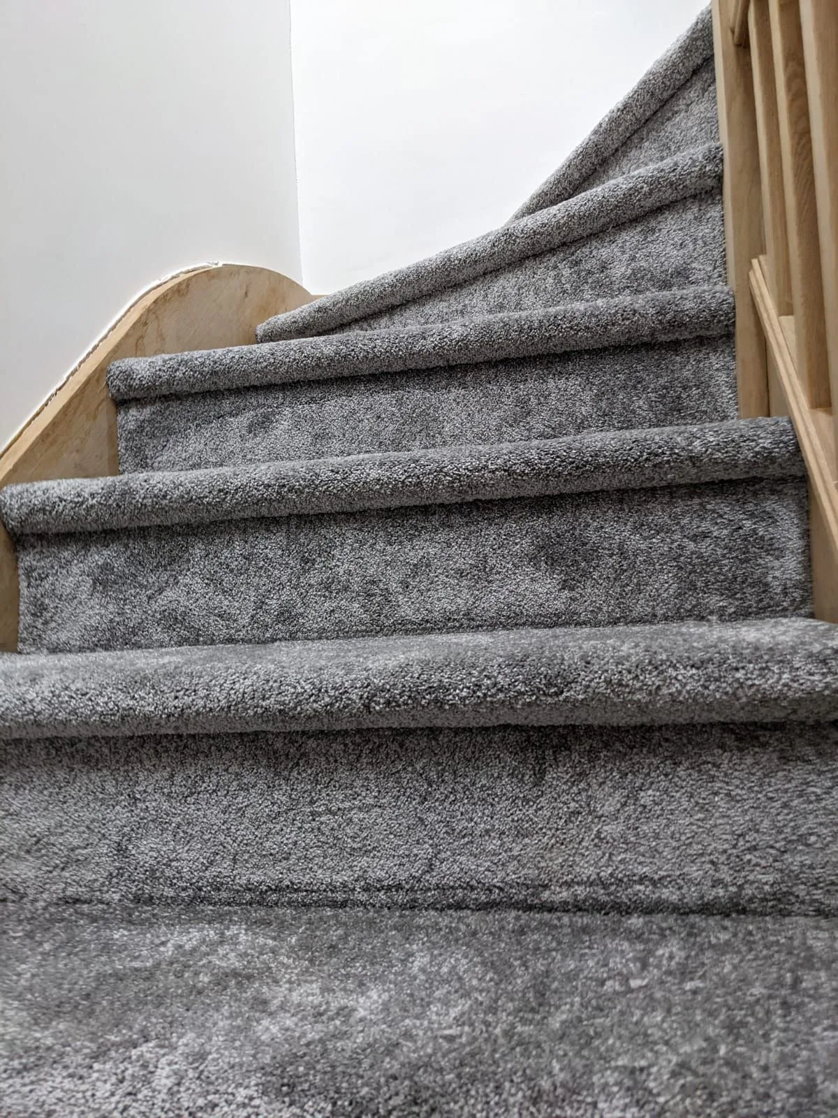 HEPA filter vacuum cleaner extracting dust from short-pile synthetic twist carpet.
