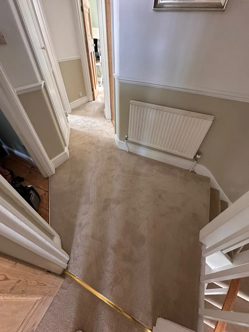 Landing with new Fulham Leather carpet and gold door bars fitted across the doorways — South Croydon