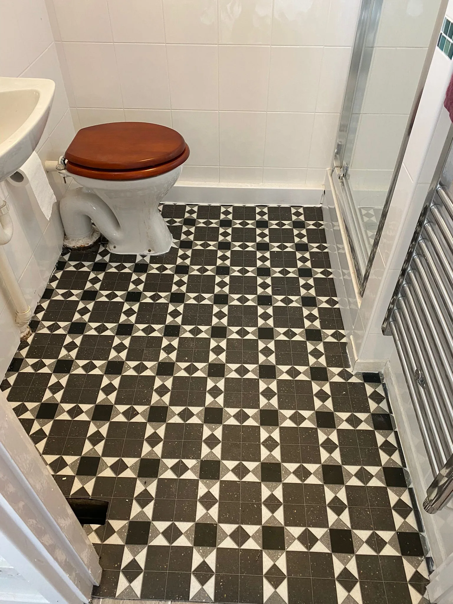 Victorian black and white geometric tile sheet vinyl professionally fitted in bathroom